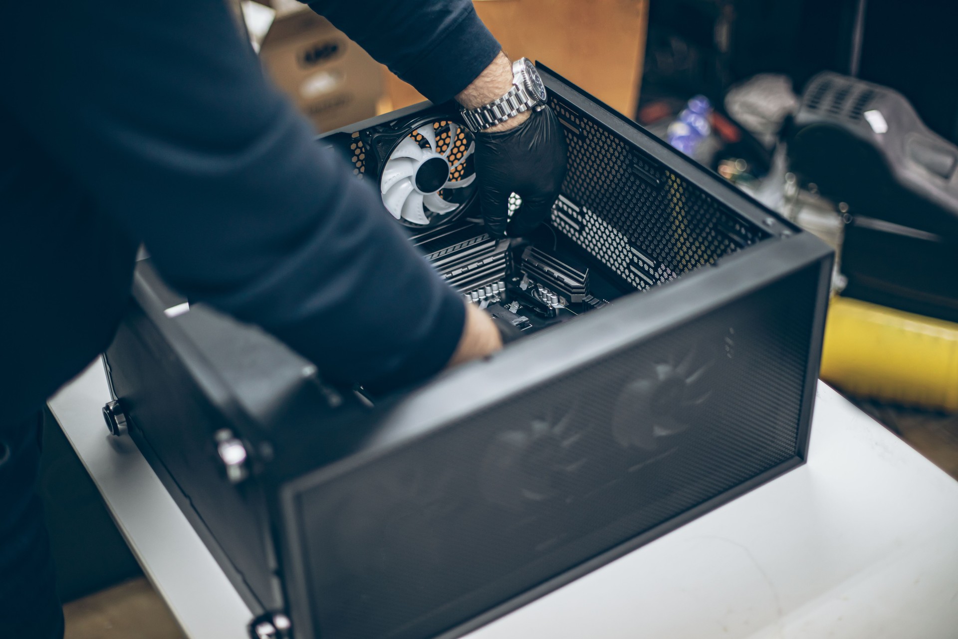 Professional man repairing and assembling a computer desktop